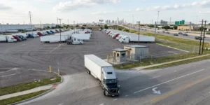 Semi truck entering a commercial parking facility near I-20 in Dallas